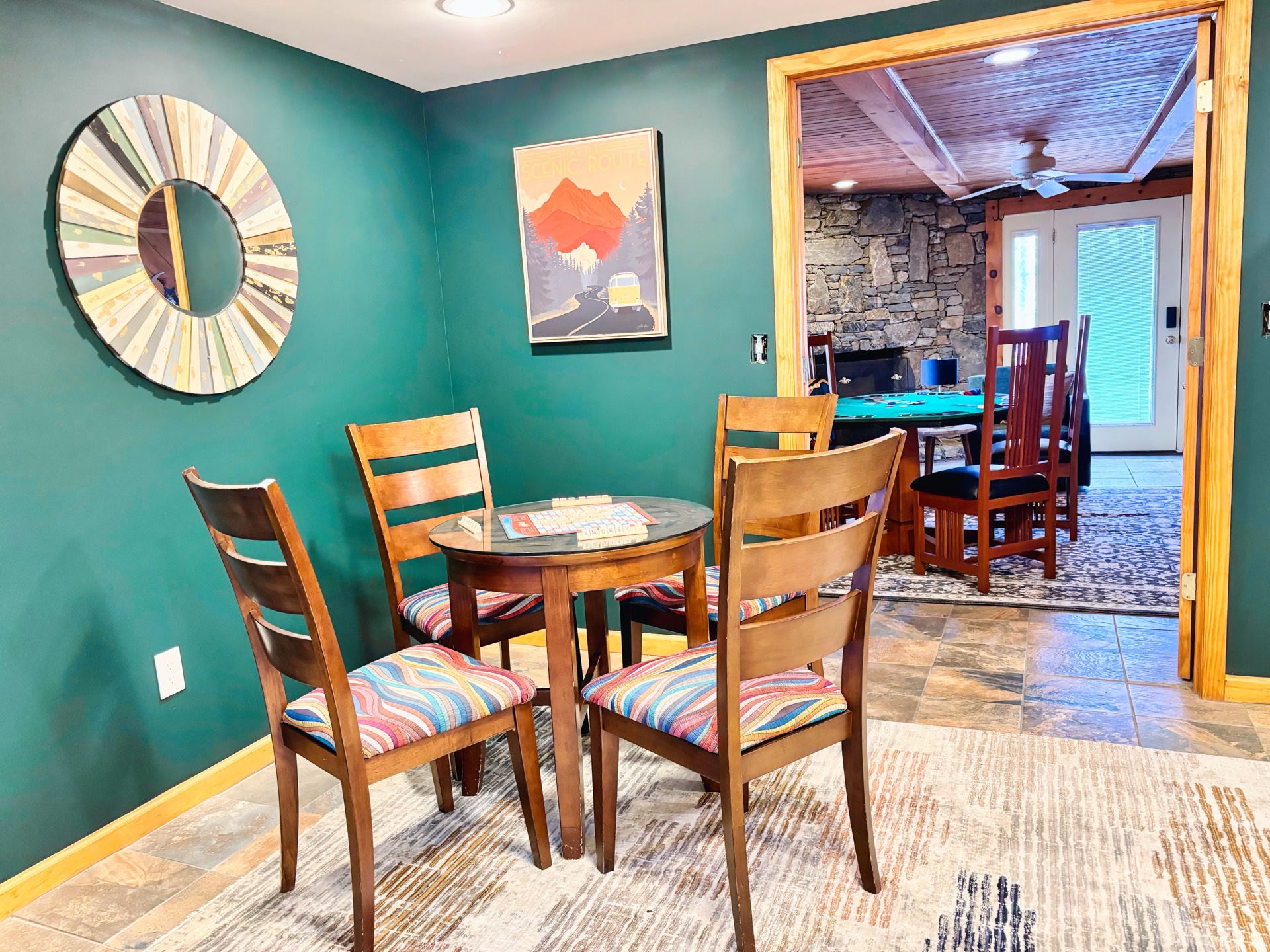 Breakfast nook with teal walls and round table