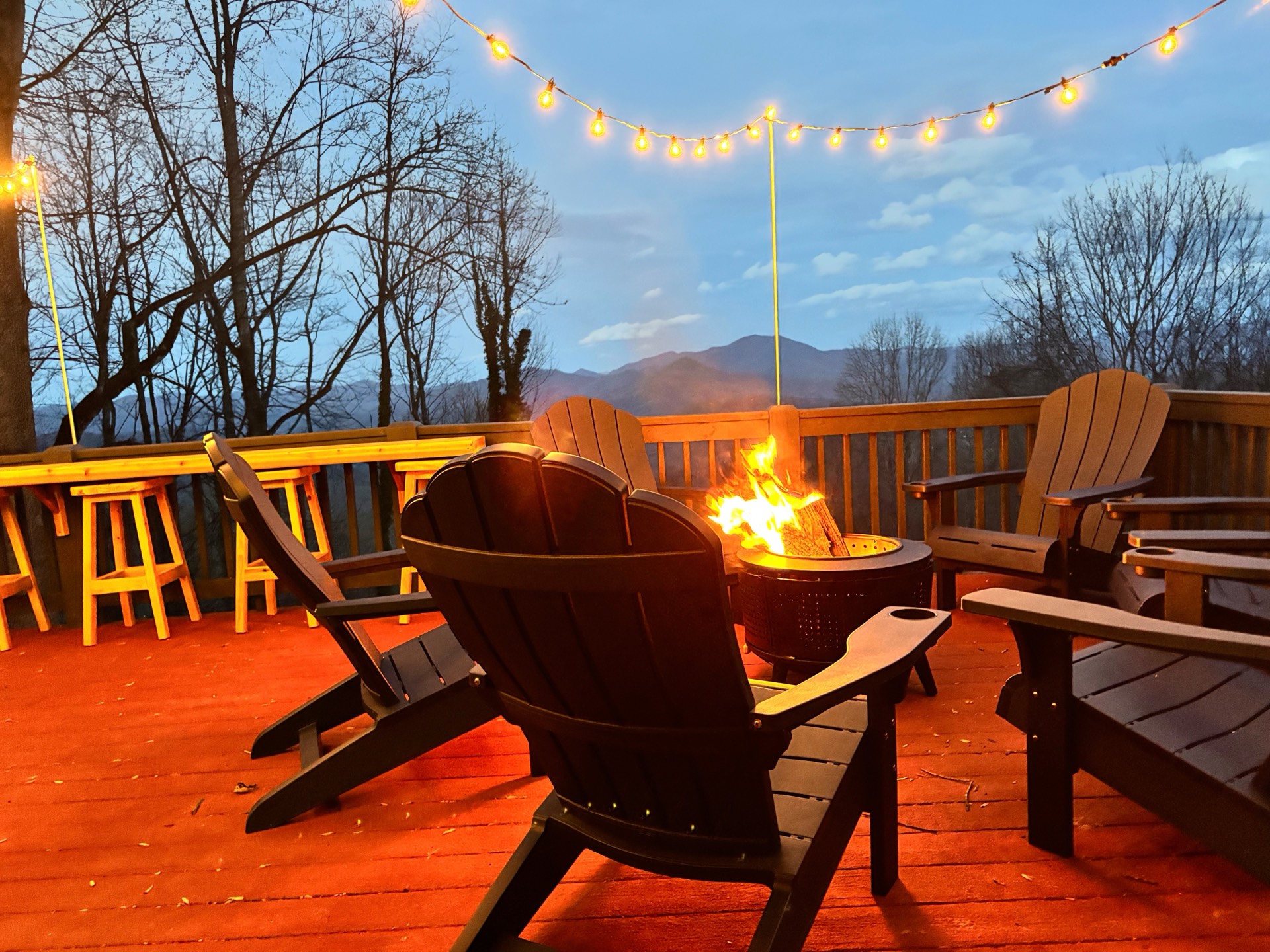 Deck fire pit at twilight with mountain view