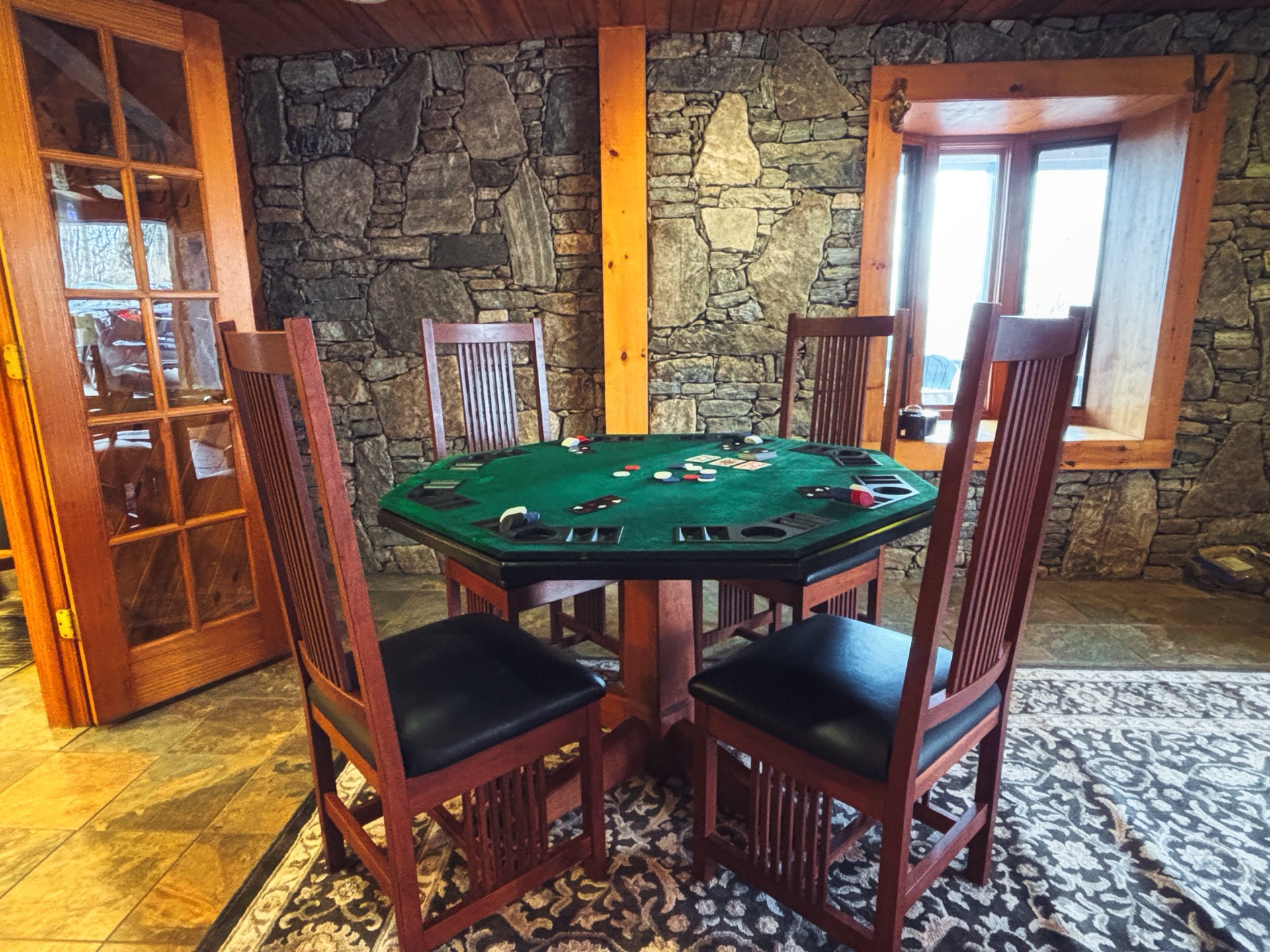 Pub room with poker table and stone accents