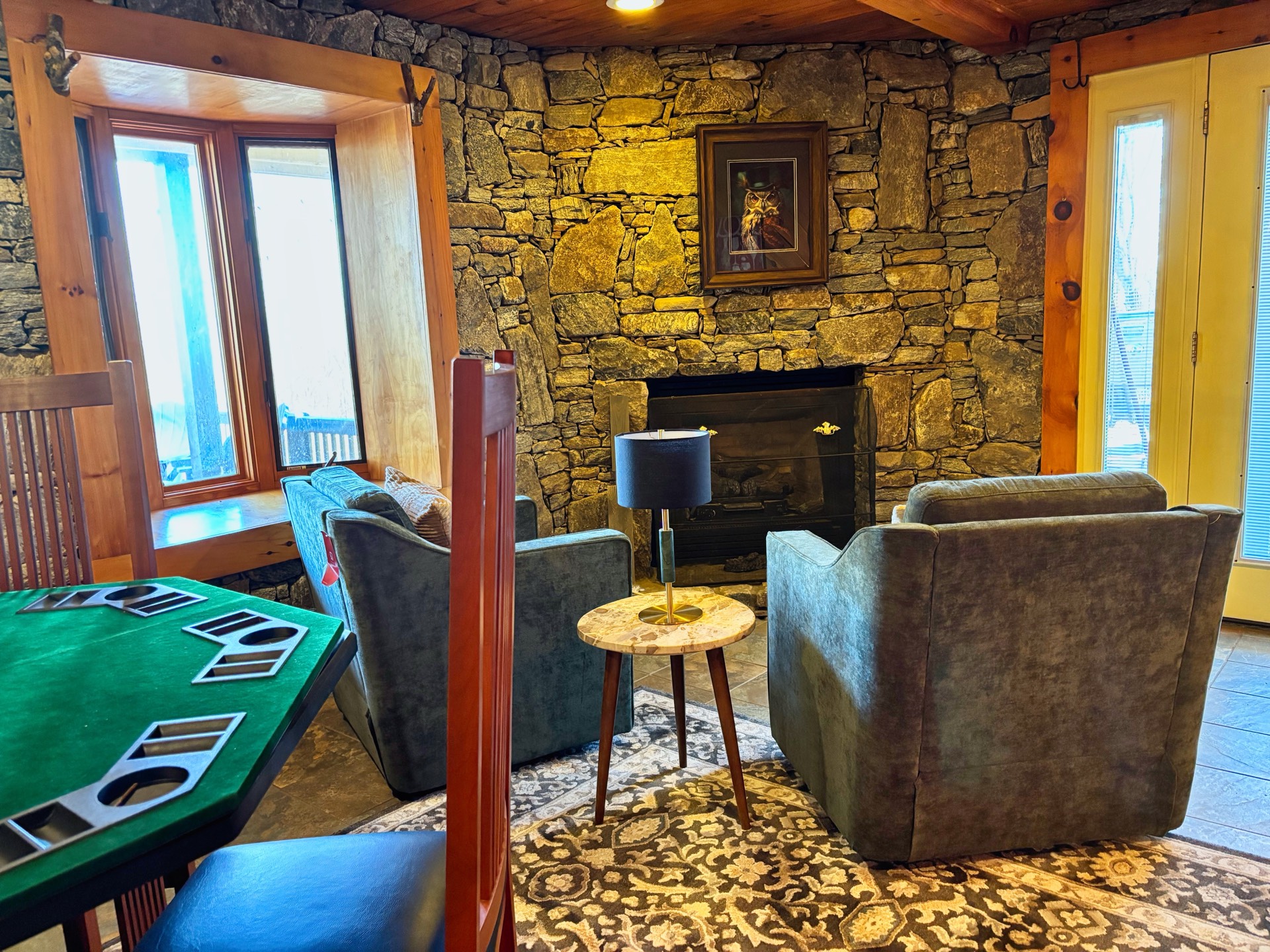 Stone fireplace lounge with armchairs